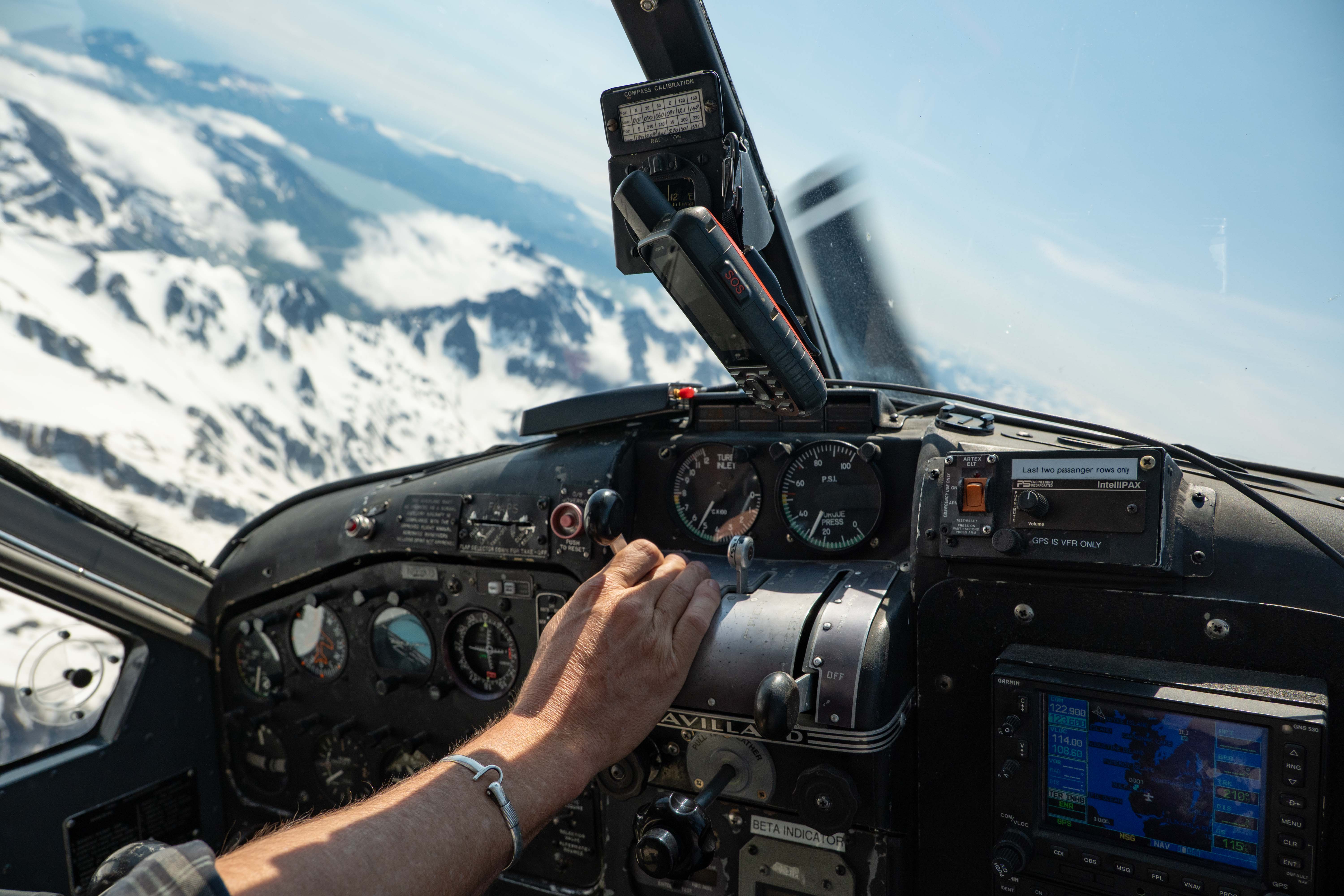 View from inside the Dehaviland beaver plane cockpit flying over Lake Clark National Park