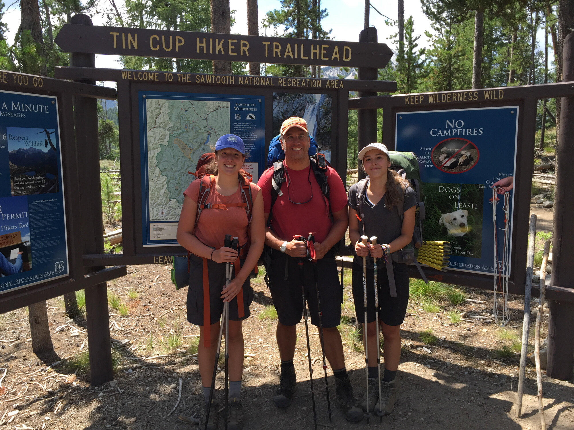Group at the Tin Cup Hiker Trailhead sign at Pettit Lake